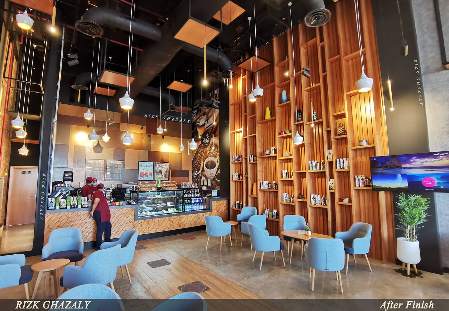 Completed Joffrey’s café interior with a timber display wall and suspended lighting